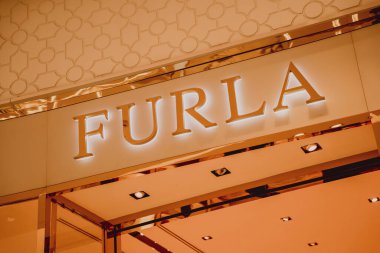 PHUKET, THAILAND - MAY 29, 2022: Furla brand retail shop logo signboard on the storefront in the shopping mall.