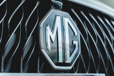 PHUKET, THAILAND - AUGUST 09, 2022: Cars logo of MG Morris Garages in showroom of dealership.