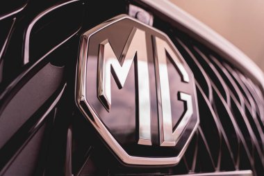 PHUKET, THAILAND - AUGUST 09, 2022: Cars logo of MG Morris Garages in showroom of dealership.