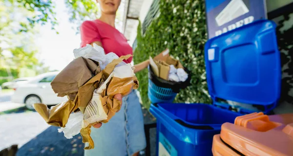 Young Beautiful Girl Throws Sorted Garbage Special Bins — стоковое фото