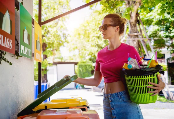 Young Beautiful Girl Throws Sorted Garbage Special Bins — стоковое фото