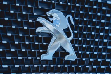 PHUKET, THAILAND - AUGUST 09, 2022: Cars logo of Peugeot in showroom of dealership.
