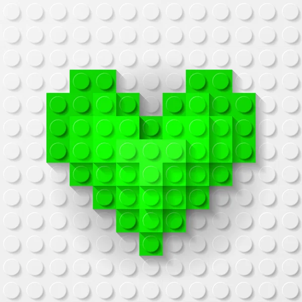 Corazón verde hecho de kit de construcción — Vector de stock