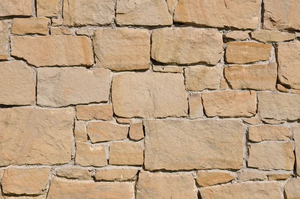 Hintergrund der Steinmauer aus Sandstein — Stockfoto