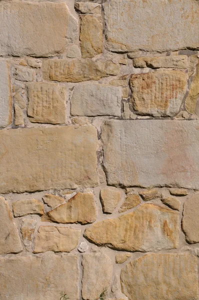 Hintergrund der Steinmauer aus Sandstein — Stockfoto