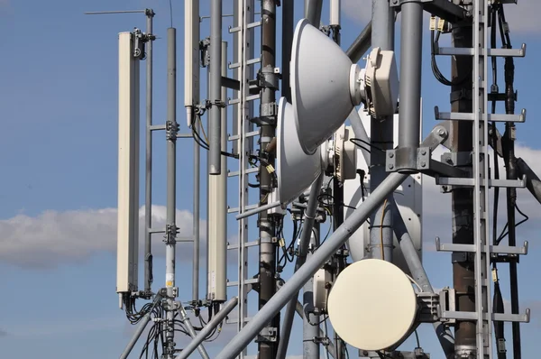 Cellular communications system on a steel tower — Stock Photo, Image