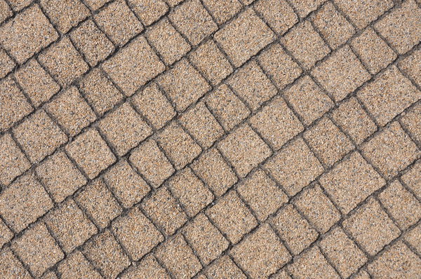 Beige paving stones on the sidewalk