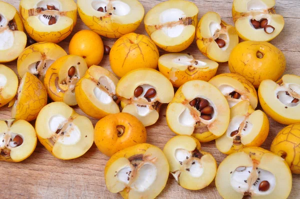 Quince fruits on the board, cut ready for processing