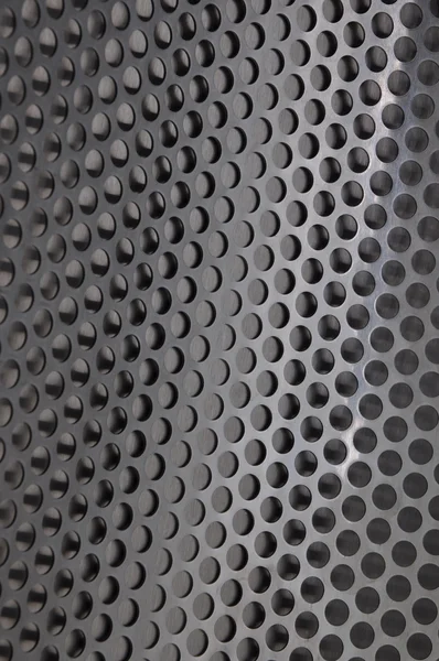 Metalen plaat oppervlak met gaten — Stockfoto