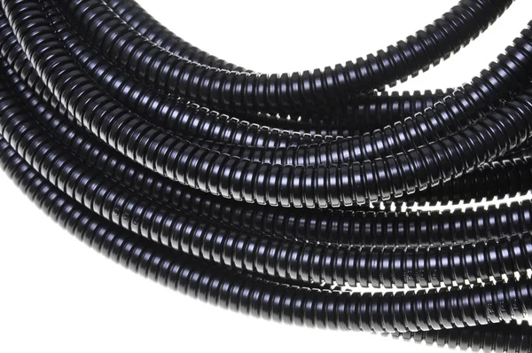 Black plastic corrugated pipe — Stock Photo, Image