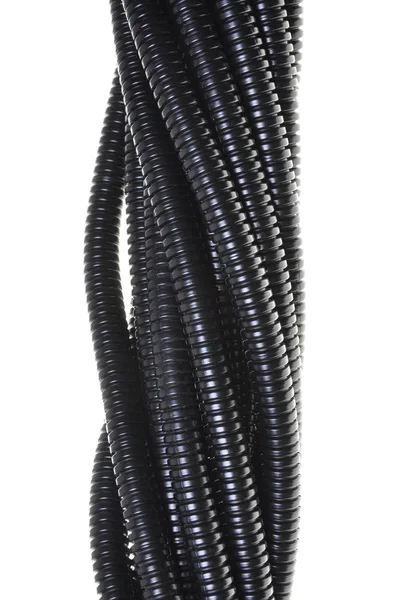 Black plastic corrugated pipe — Stock Photo, Image