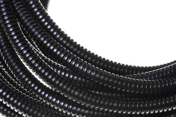 Black plastic corrugated pipe — Stock Photo, Image