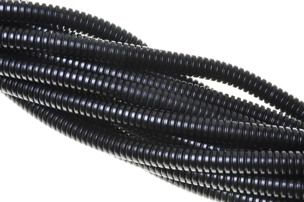 Black plastic corrugated pipe — Stock Photo, Image