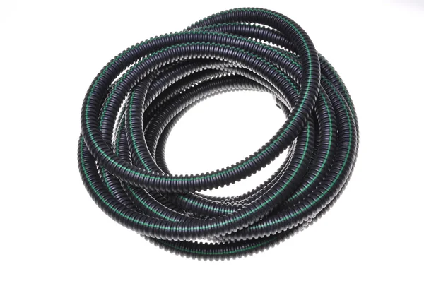 Tubo ondulado para cabos elétricos enrolados em um círculo — Fotografia de Stock