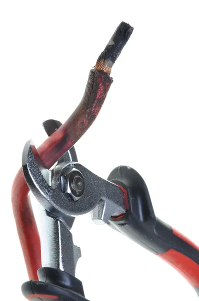 Nippers is cutting damaged red cable — Stock Photo, Image