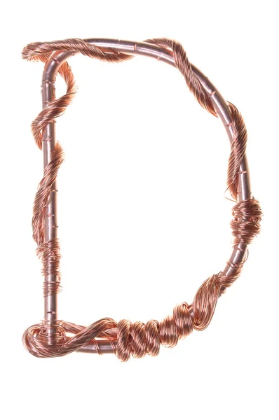 Twisted copper wire in the shape of the letter D — Stock Photo, Image