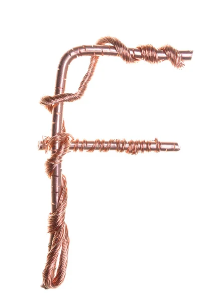 Twisted copper wire in the shape of the letter F — Stock Photo, Image