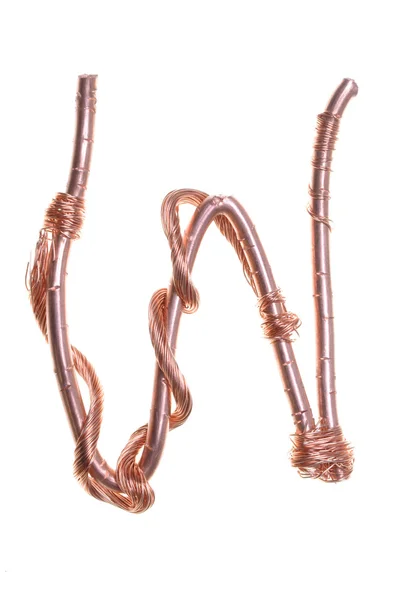 Twisted copper wire in the shape of the letter W — Stock Photo, Image