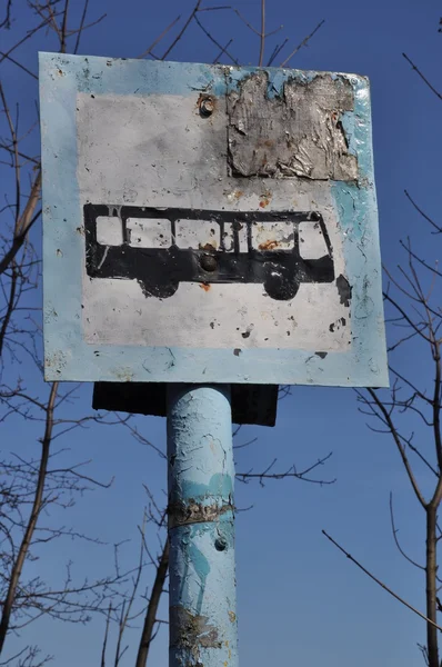 Rusty bus sign on pillar — Stock Photo, Image