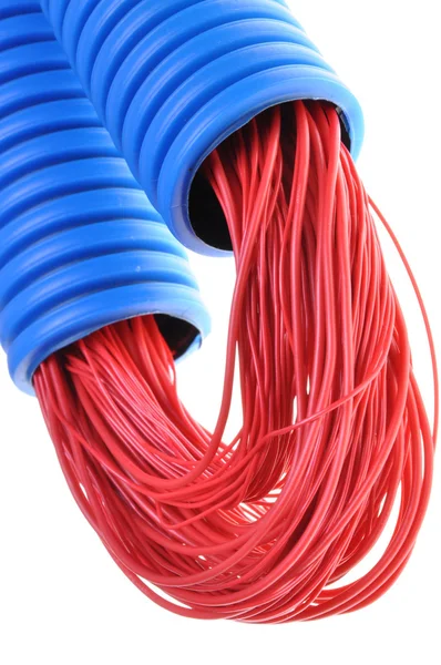 Blue corrugated pipe with red cables — Stock Photo, Image