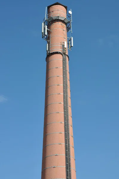 Brick chimney with antenna cellular systems — Stock Photo, Image