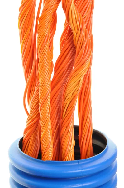 Blå korrugerade rör med orange kablar — Stockfoto