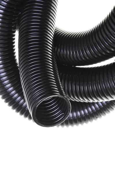 Black plastic corrugated pipe — Stock Photo, Image