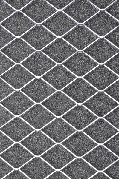 Filtre à air, grille métallique sur gris — Photo