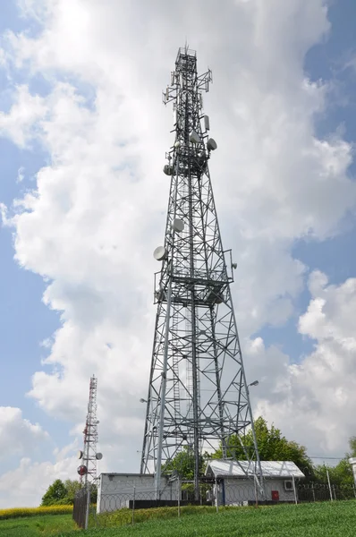 Telecommunication tower on the field — Stock Photo, Image