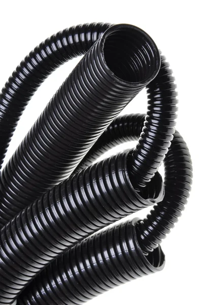 Black plastic corrugated pipe — Stock Photo, Image