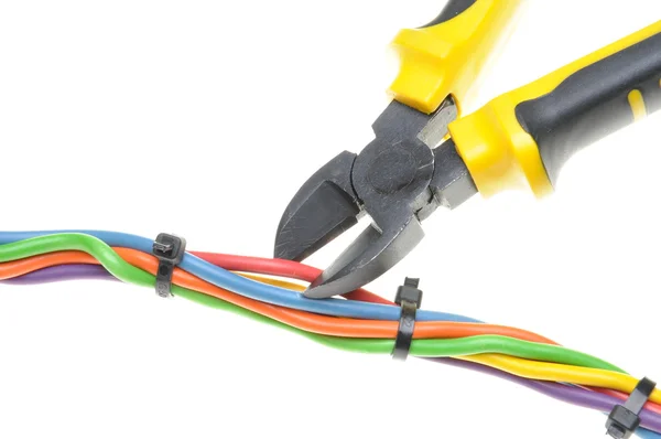 Yellow metal nippers and cable — Stock Photo, Image