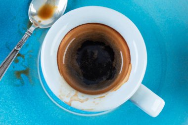 Cup of coffee espresso with spoon, close-up