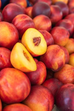 Heap of ripe nectarines on street food market
