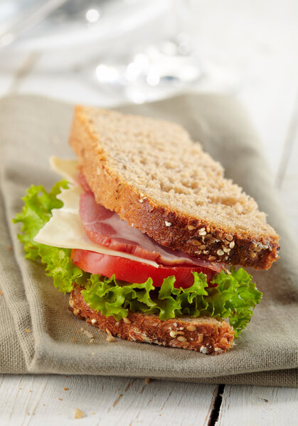 fresh deli sandwich with tomatoes, swiss chees, lettuce