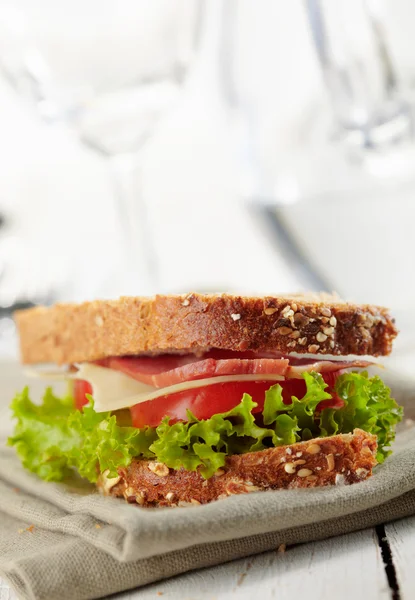 Fresh deli sandwich with tomatoes, swiss chees, lettuce — Stock Photo, Image