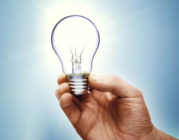 Light bulb in hand — Stock Photo, Image