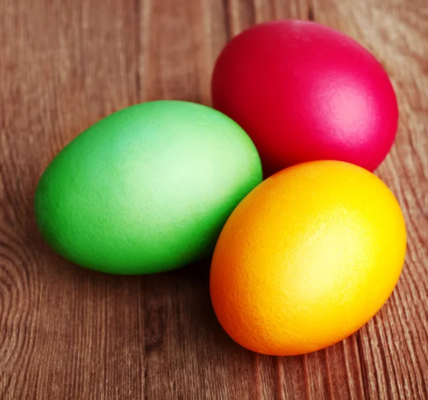 Painted Easter Eggs on wooden background — Stock Photo, Image