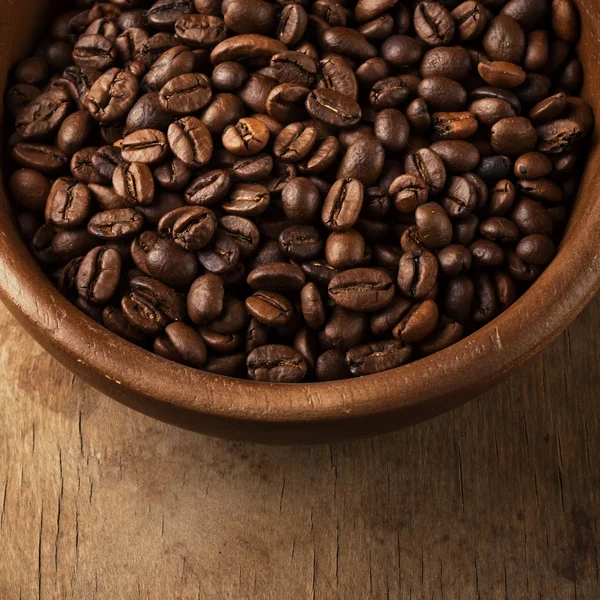 Coffee beans on wood bowl — Stock Photo, Image