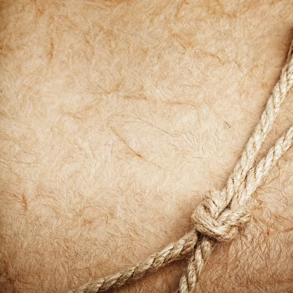 Old paper with rope — Stock Photo, Image