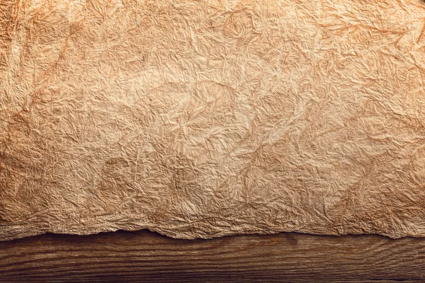 Papel viejo sobre madera envejecida marrón — Foto de Stock