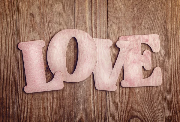 Letras de madeira formando palavra AMOR — Fotografia de Stock