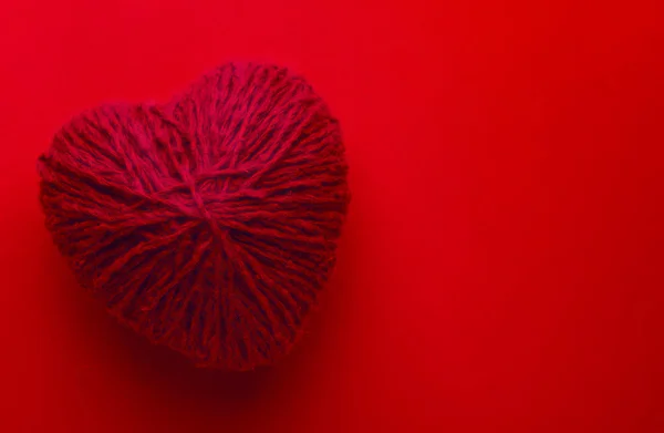 Red heart shape symbol made from wool — Stock Photo, Image