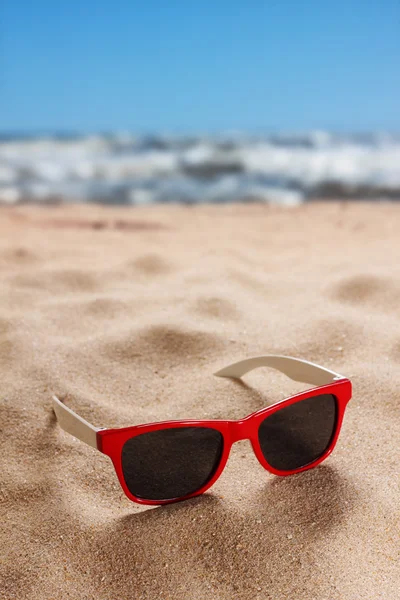 Sunglasses on sand — Stock Photo, Image