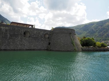 Kotor is a city in Montenegro, located on the limestone cliffs of Mount Lovcen on the Adriatic coast. In the medieval Old Town, surrounded by a fortress wall, many squares, winding streets and several Romanesque churches