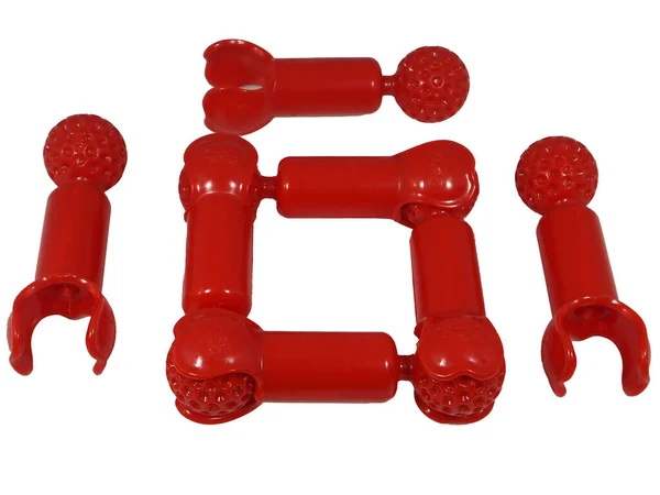 Elementos Construtor Brinquedos Feitos Plástico Vermelho Fundo Isolado Branco — Fotografia de Stock
