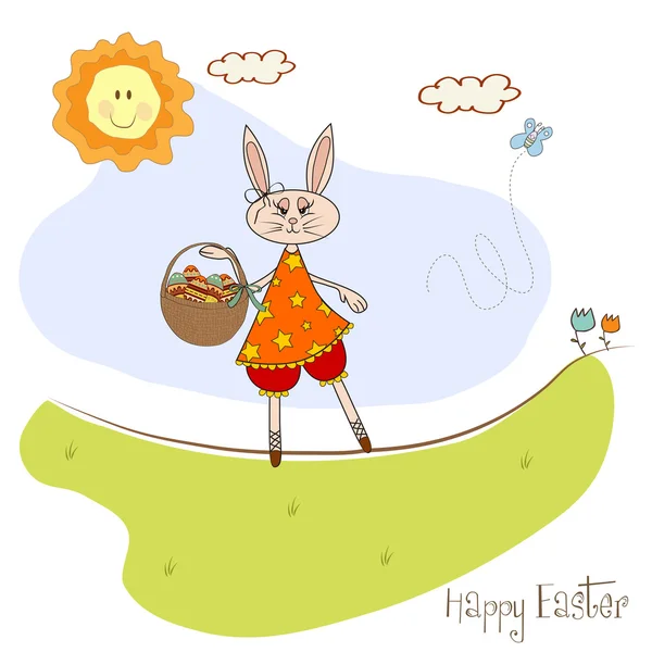 Easter bunny with a basket of Easter eggs — Stock Photo, Image