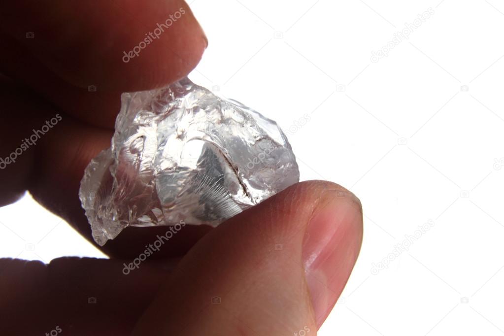 natural diamond in the human hand