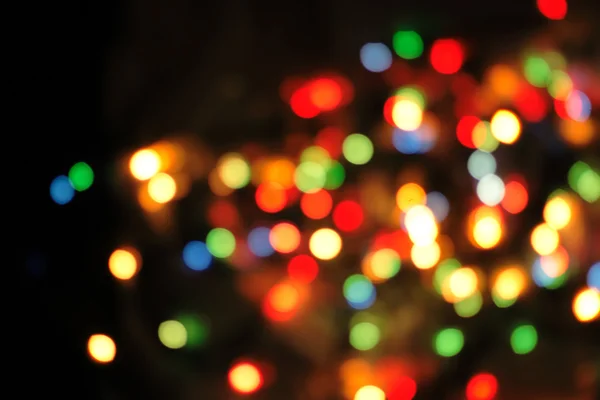 Vánoční pozadí z barevné vánoční světla — Stock fotografie