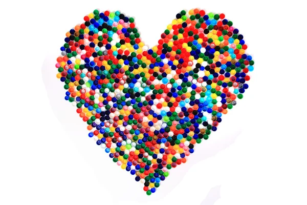 色のプラスチック製のキャップの心 — ストック写真