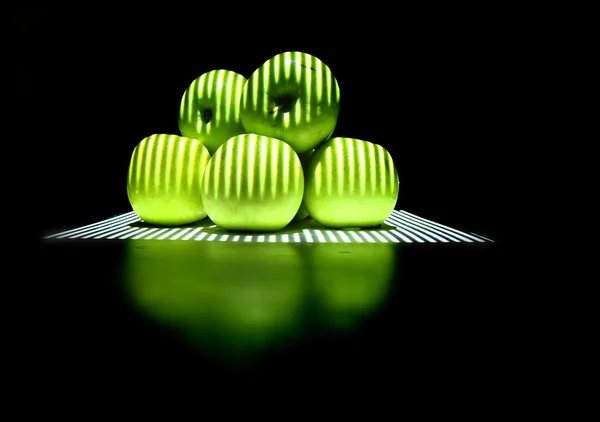 Green apples in the dark night — Stock Photo, Image